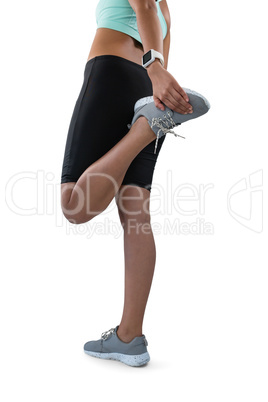 Low section of female athlete exercising