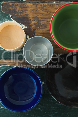 Various type of empty bowl on wooden table