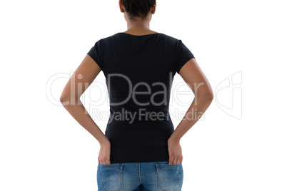 Rear view of woman with hands in pockets