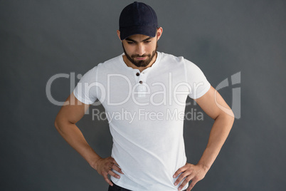 Handsome man posing against grey background