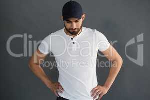 Handsome man posing against grey background