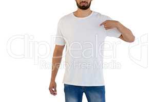 Mid-section of man pointing at t-shirt