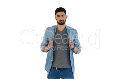 Handsome man posing against white background