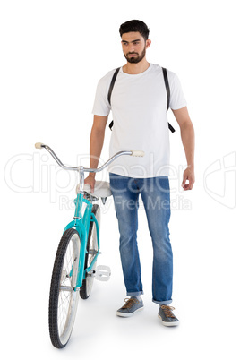 Man posing with bicycle against white background