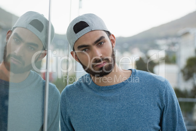 Man leaning on glass