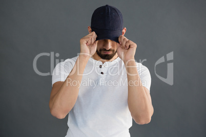 Handsome man posing against grey background