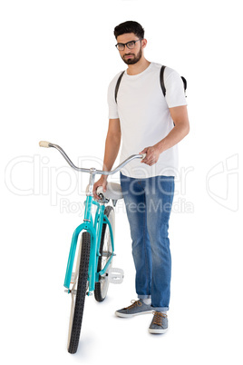 Handsome man posing with bicycle against white background