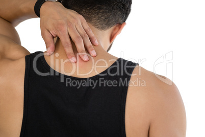 Rear view of man touching his neck