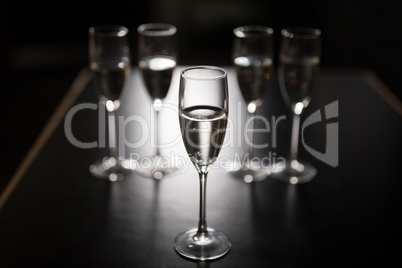 Glasses of wine on table