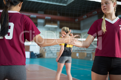 Two female players shaking hands with each other