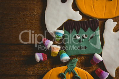Close up of cookies with candies on wooden table