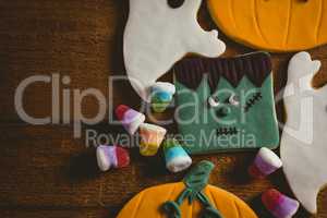 Close up of cookies with candies on wooden table