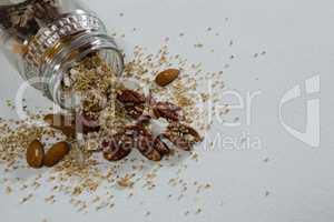 Dried fruits spilling out of bottle