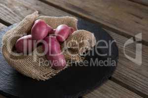 Sweet potatoes on a textile in a tray