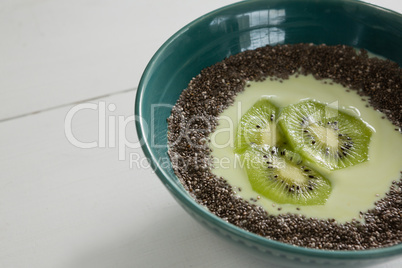 Breakfast and sliced kiwi in bowl