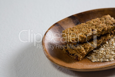 Granola bar and oatmeal in bowl