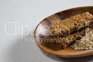 Granola bar and oatmeal in bowl