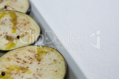 Sliced eggplants arranged in a tray