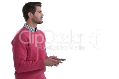 Thoughtful man holding mobile phone