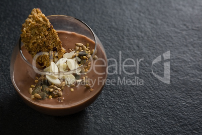 Granola, dried fruits and chocolate mousse in glass