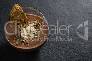 Granola, dried fruits and chocolate mousse in glass