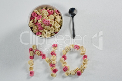 Honeycomb cereal arranged text no with bowl and spoon