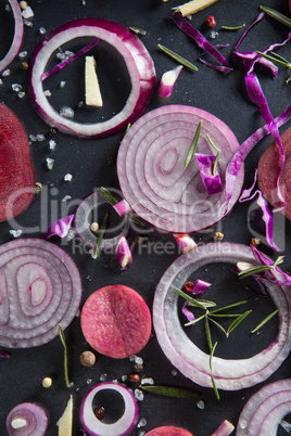 Close-up of onions with beetroots in tray