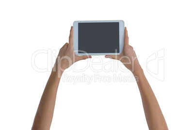 Womans hand holding digital tablet