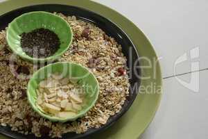 Muesli and cereal in plate on white background