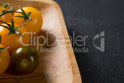 Close-up of cherry tomatoes in wooden plate