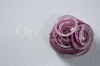 Sliced onions on a white background