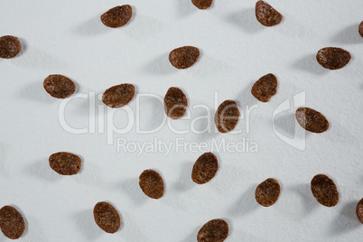 Chocolate cornflakes on white background