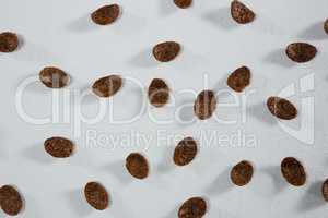 Chocolate cornflakes on white background