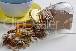 Breakfast cereals spilling from jar