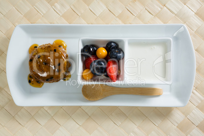 Healthy breakfast in serving plate on place mat