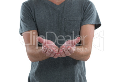 Man with cupped hands against white background