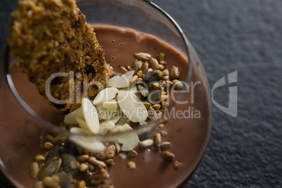 Granola, dried fruits and chocolate mousse in glass