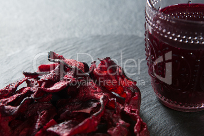 Close-up of beetroot with juice glass