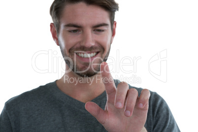 Man pretending to touch an invisible screen