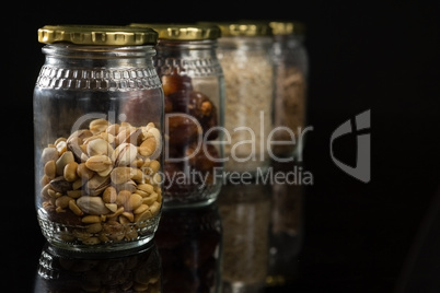 Dried fruits and breakfast cereals in glass jar