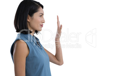 Female executive touching invisible screen