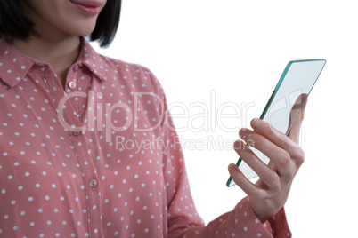 Mid section of female executive holding a glass smartphone