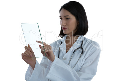 Female doctor using a glass digital tablet