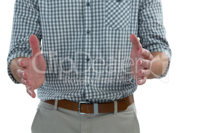 Man pretending to hold an invisible object