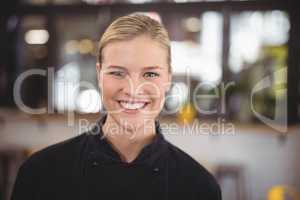 Portrait of smiling attractive waitress