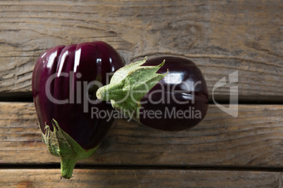 Two eggplant on wooden table