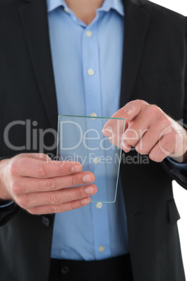 Mid section of businessman using interface