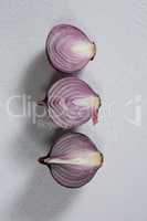 Halved onions on a white background