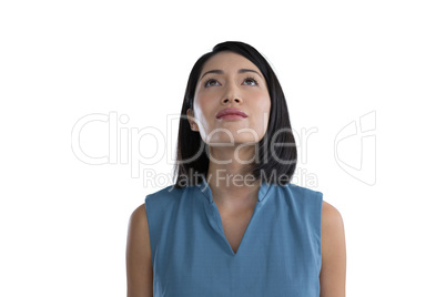 Thoughtful female executive against white background