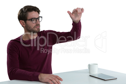 Man pretending to use an invisible screen